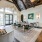 Lounge with high ceilings and a community table for socializing